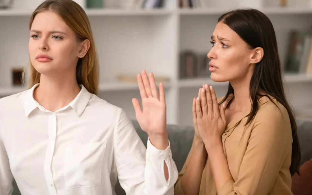 Person holding up hand with sign on it saying 'no'