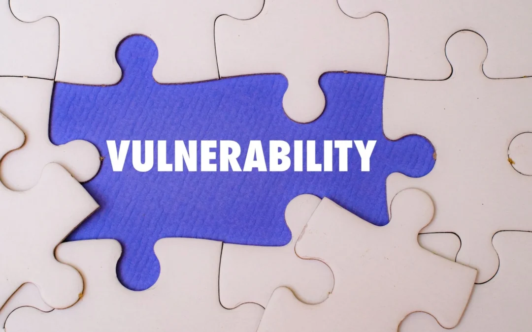 Person holding a sign with a switch halfway between the words 'strength' and 'weakness'