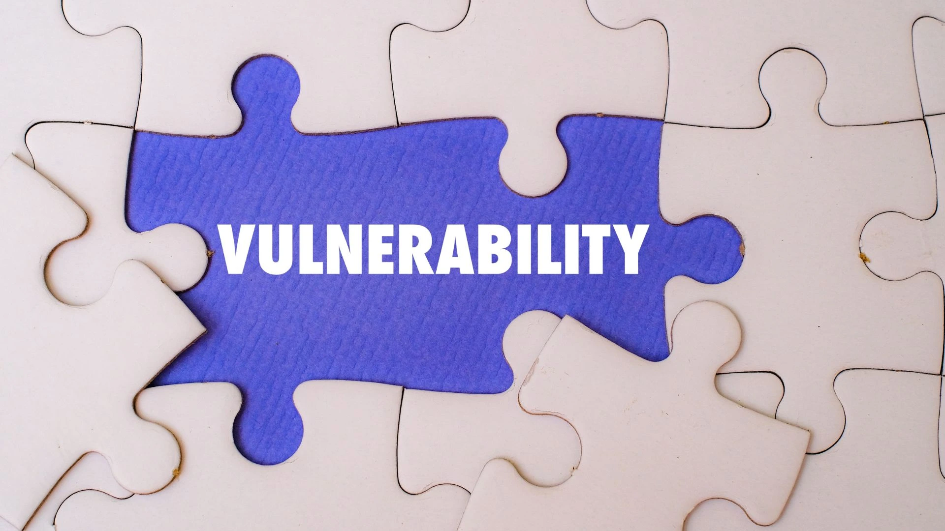 Person holding a sign with a switch halfway between the words 'strength' and 'weakness'