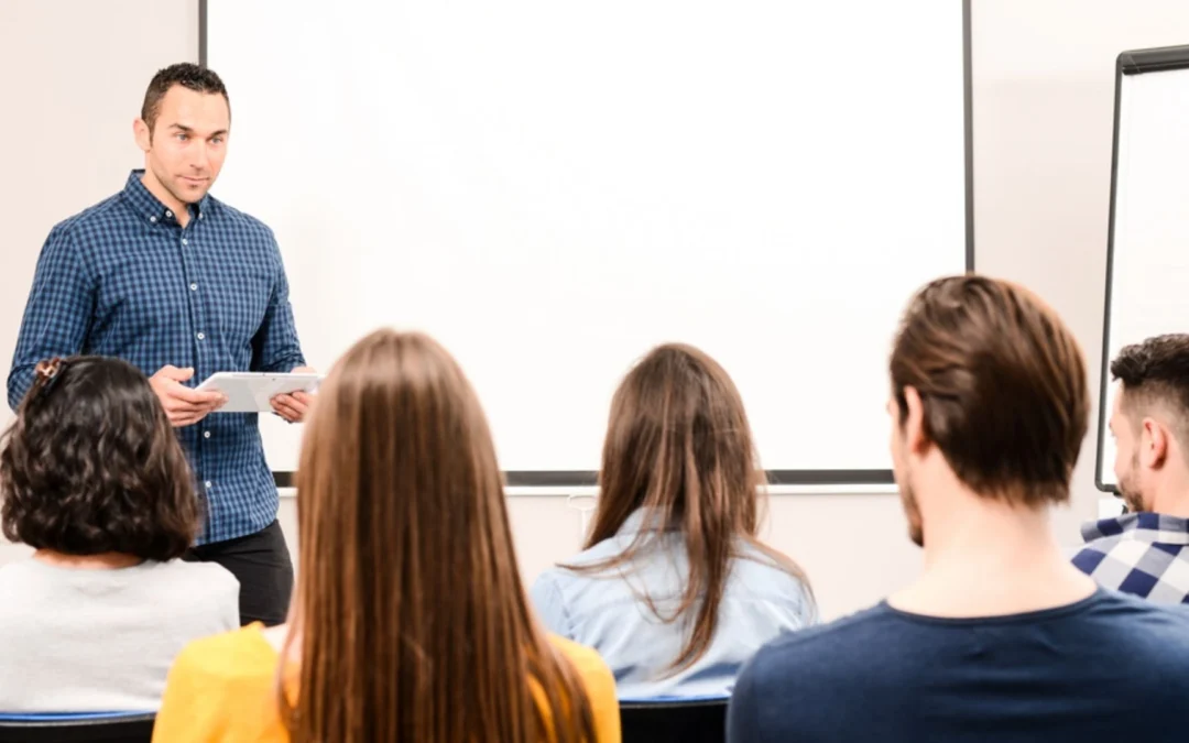 person teaching a group of teammates