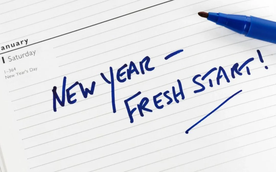notepad with words 'New Year, Fresh Start' written on it