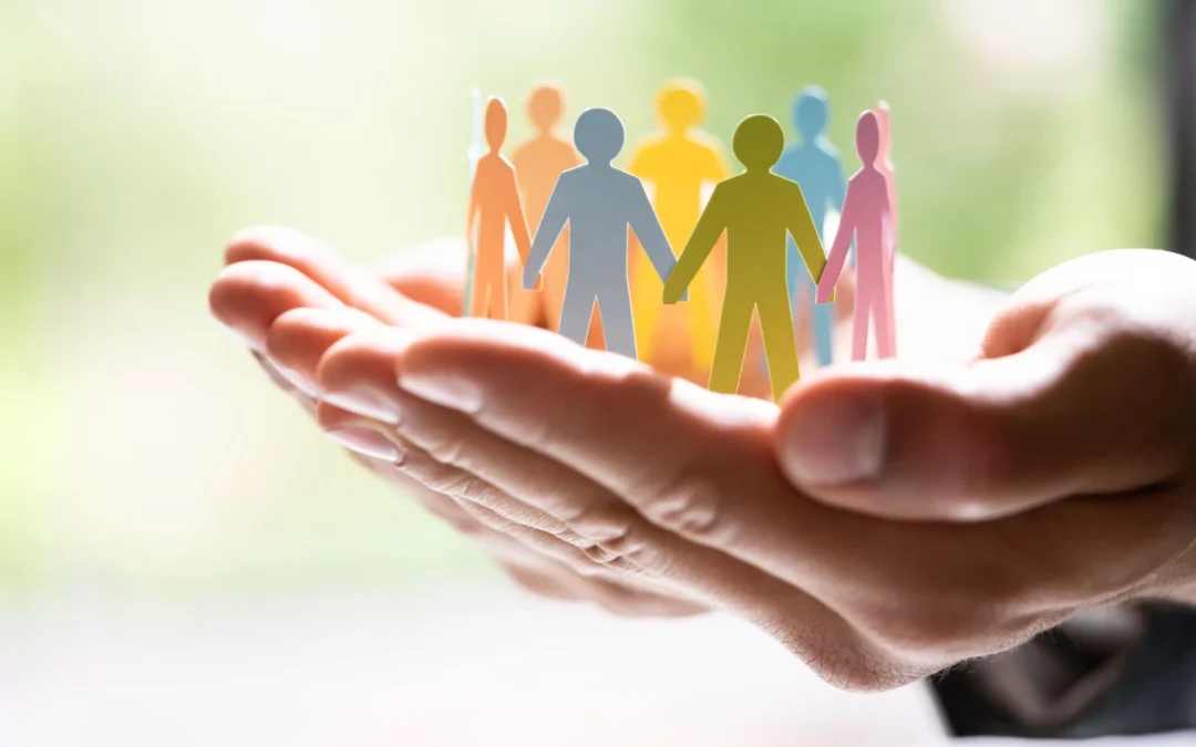 four people with paper bags over their heads spelling out 'team'