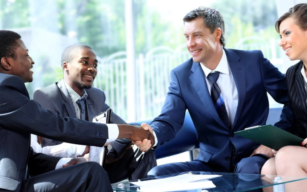 group of team members shaking hands