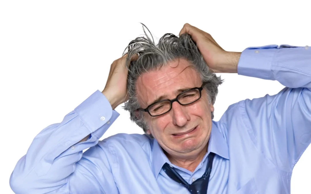 person tearing at their hair