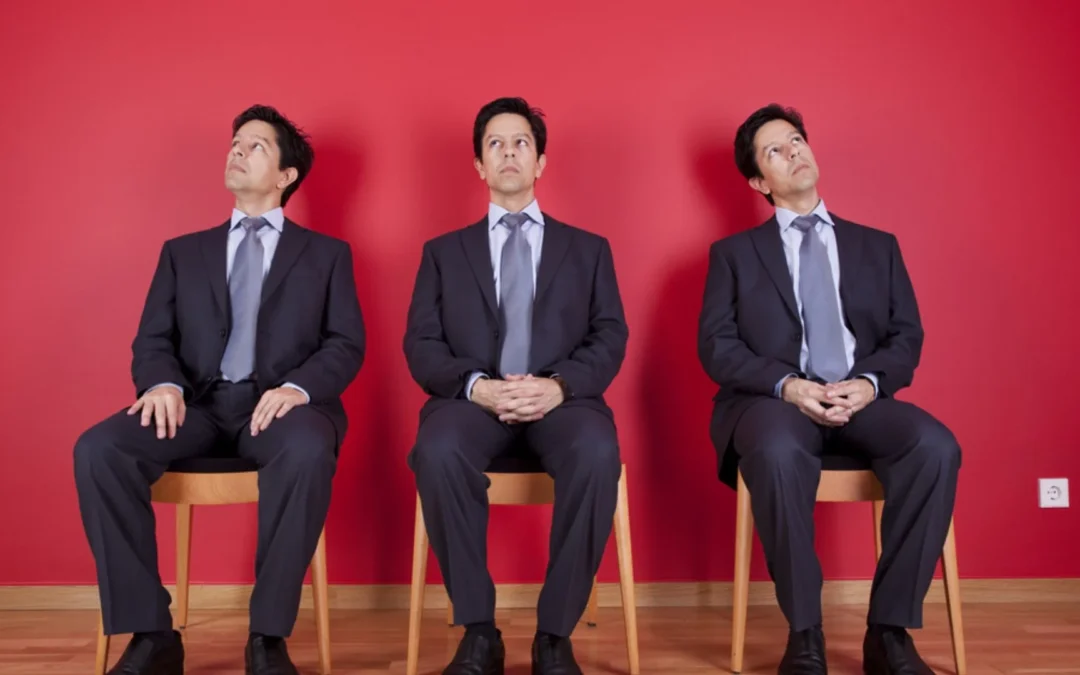 three people sitting in a row