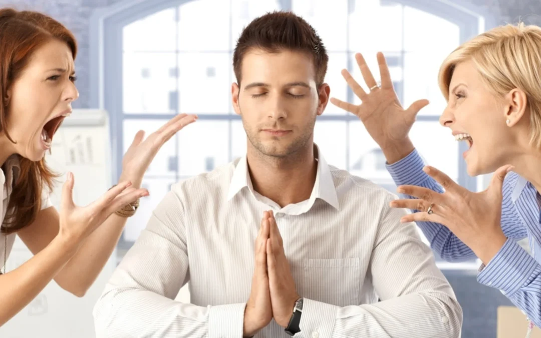 person staying calm while co-workers yell