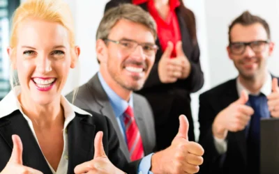 group of team members giving thumbs up