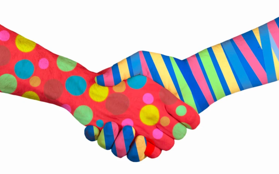 two arms with different patterns shaking