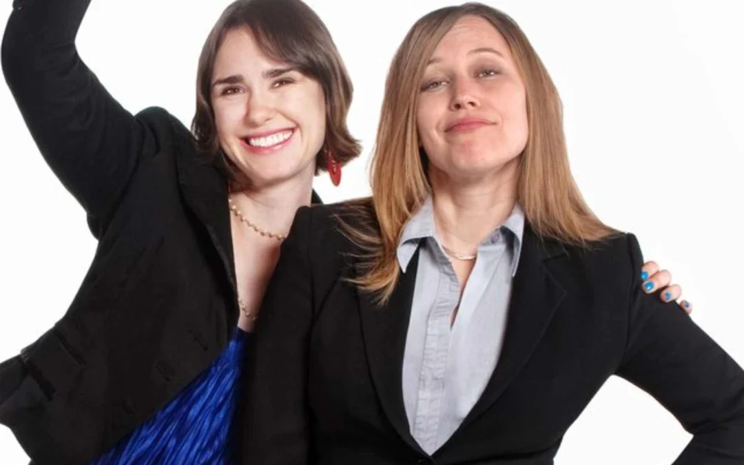 one person holding a knife behind another person's back