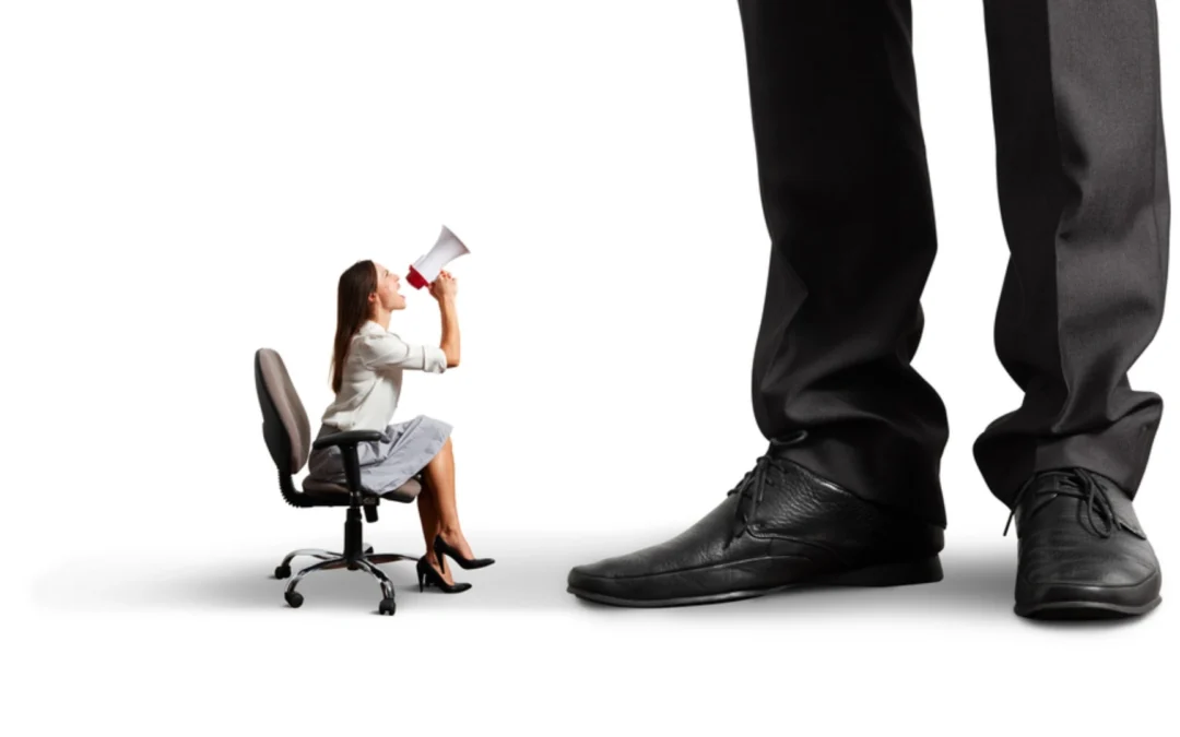 tiny person shouting up at a giant person with a megaphone