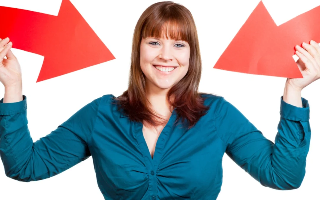 person holding two arrows pointing at themselves