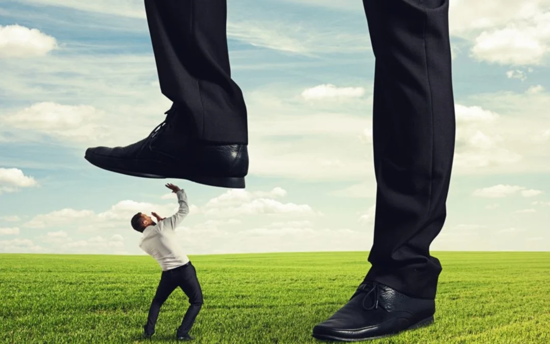 giant foot stepping on a tiny person