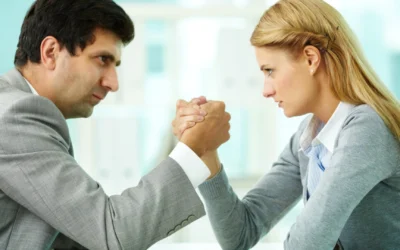 two business people arm wrestling