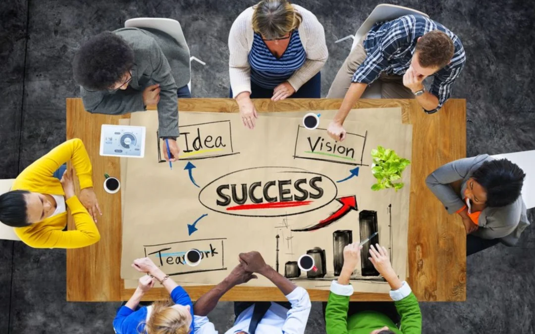 variety of people sitting around a brainstorming table