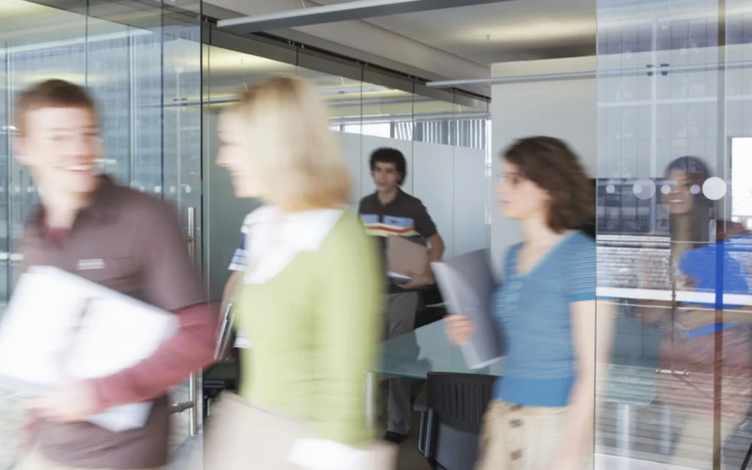 people leaving a meeting room