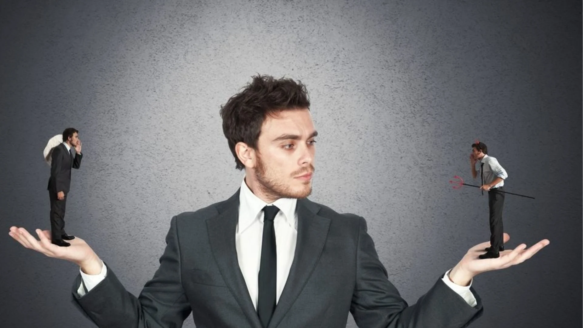 person balancing a devil in one hand and an angel in the other