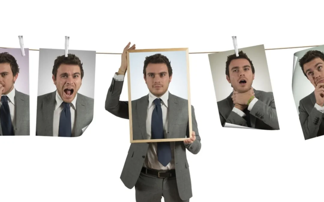 person looking at pictures of himself making different facial expressions