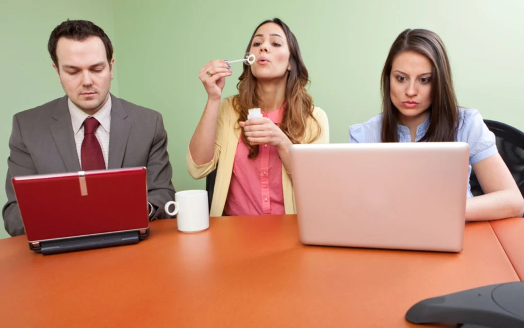 person blowing bubbles in a meeting