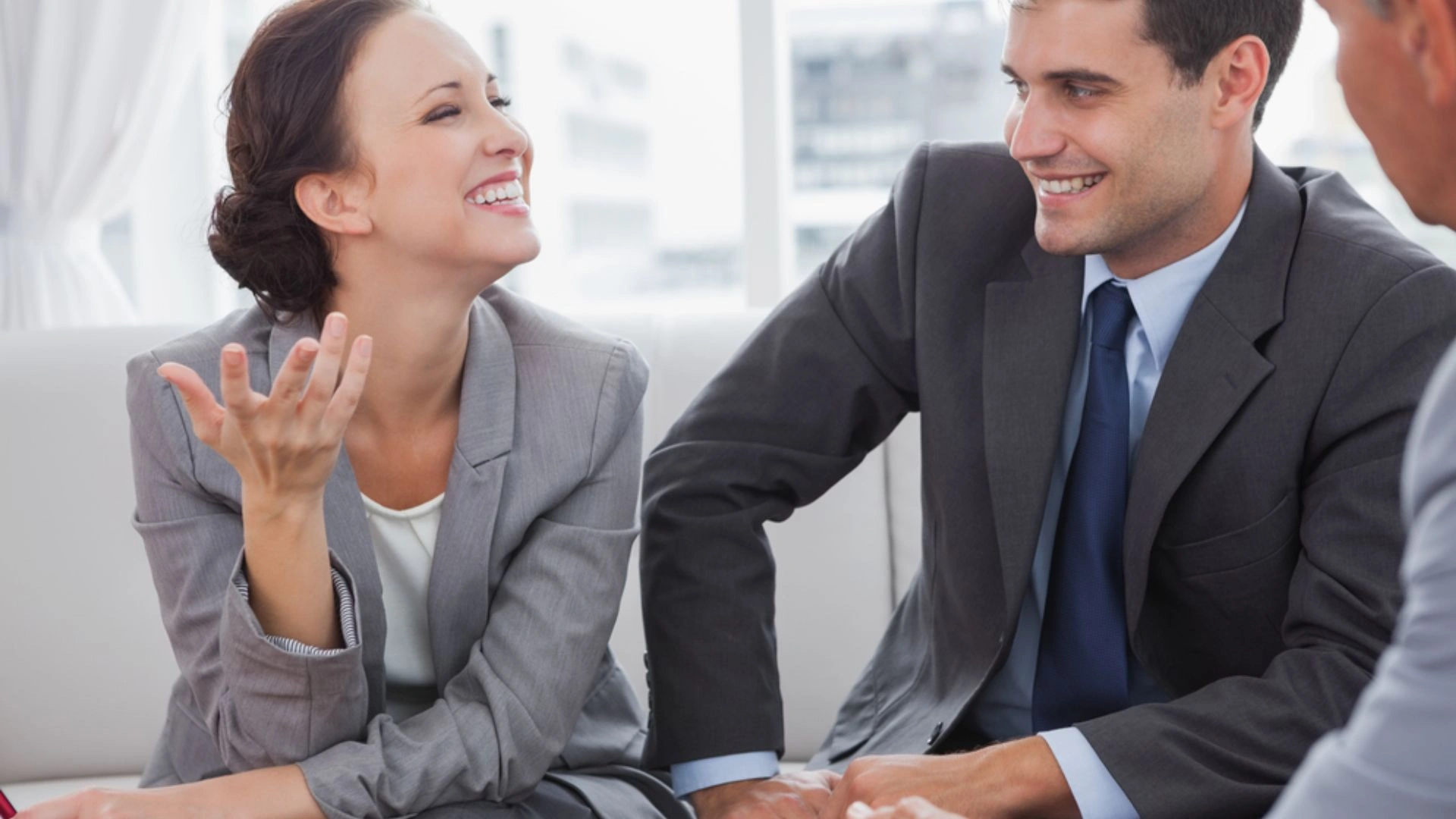 two team members conversing