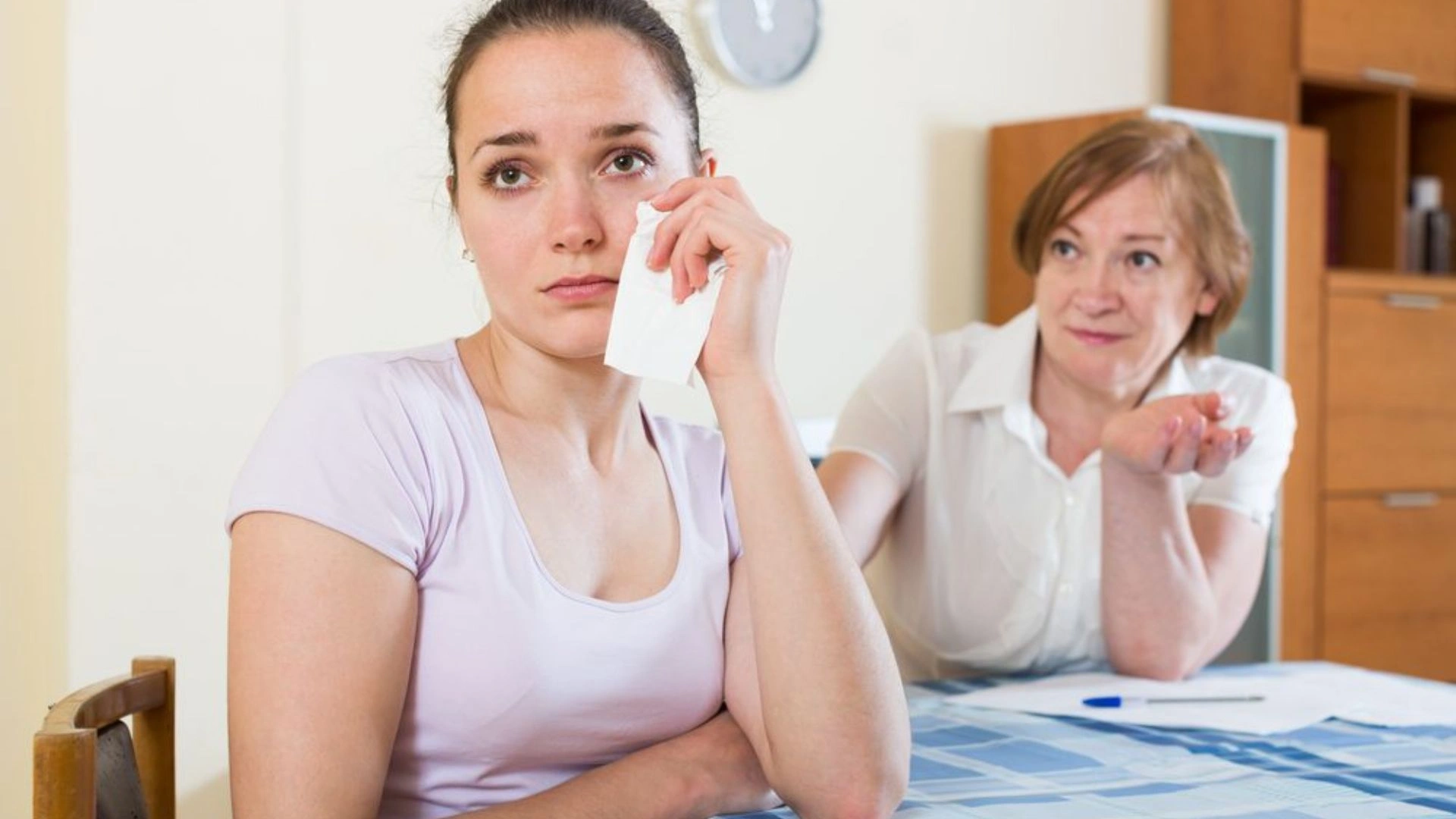 boss talking to a person who is crying