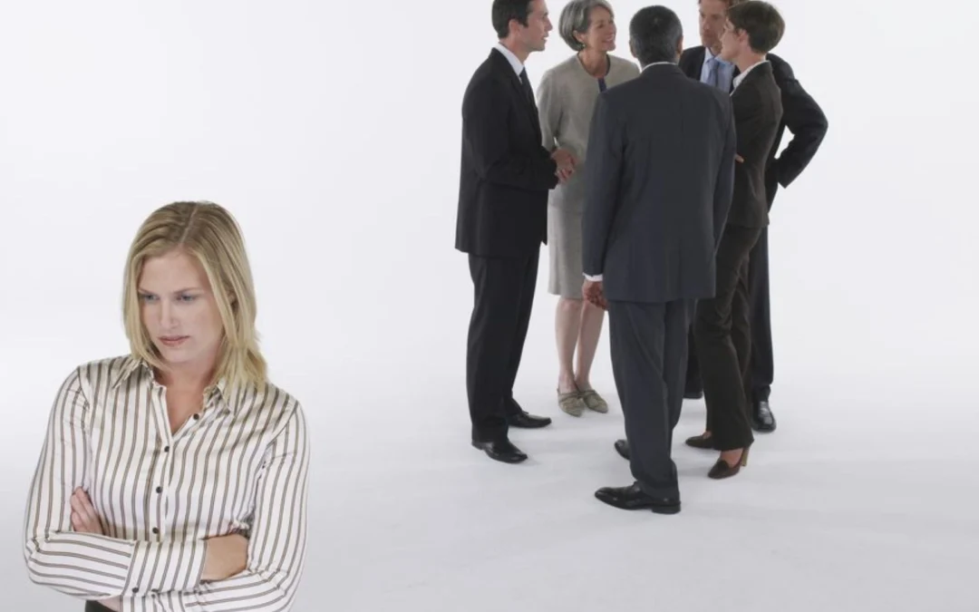 person standing ostracized from a group
