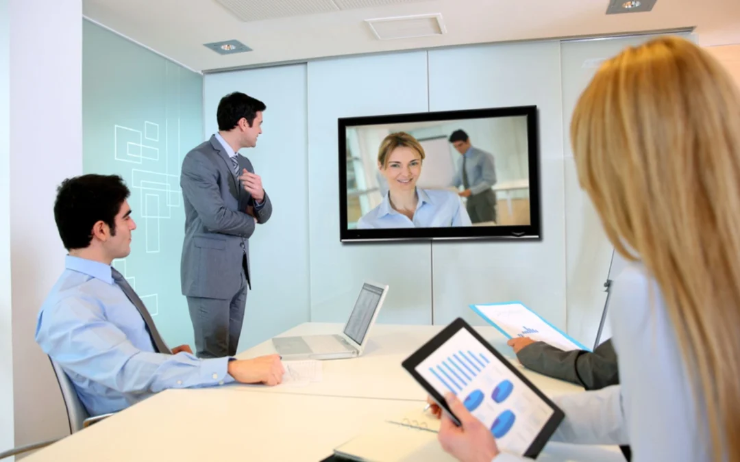 people sitting around a video conference
