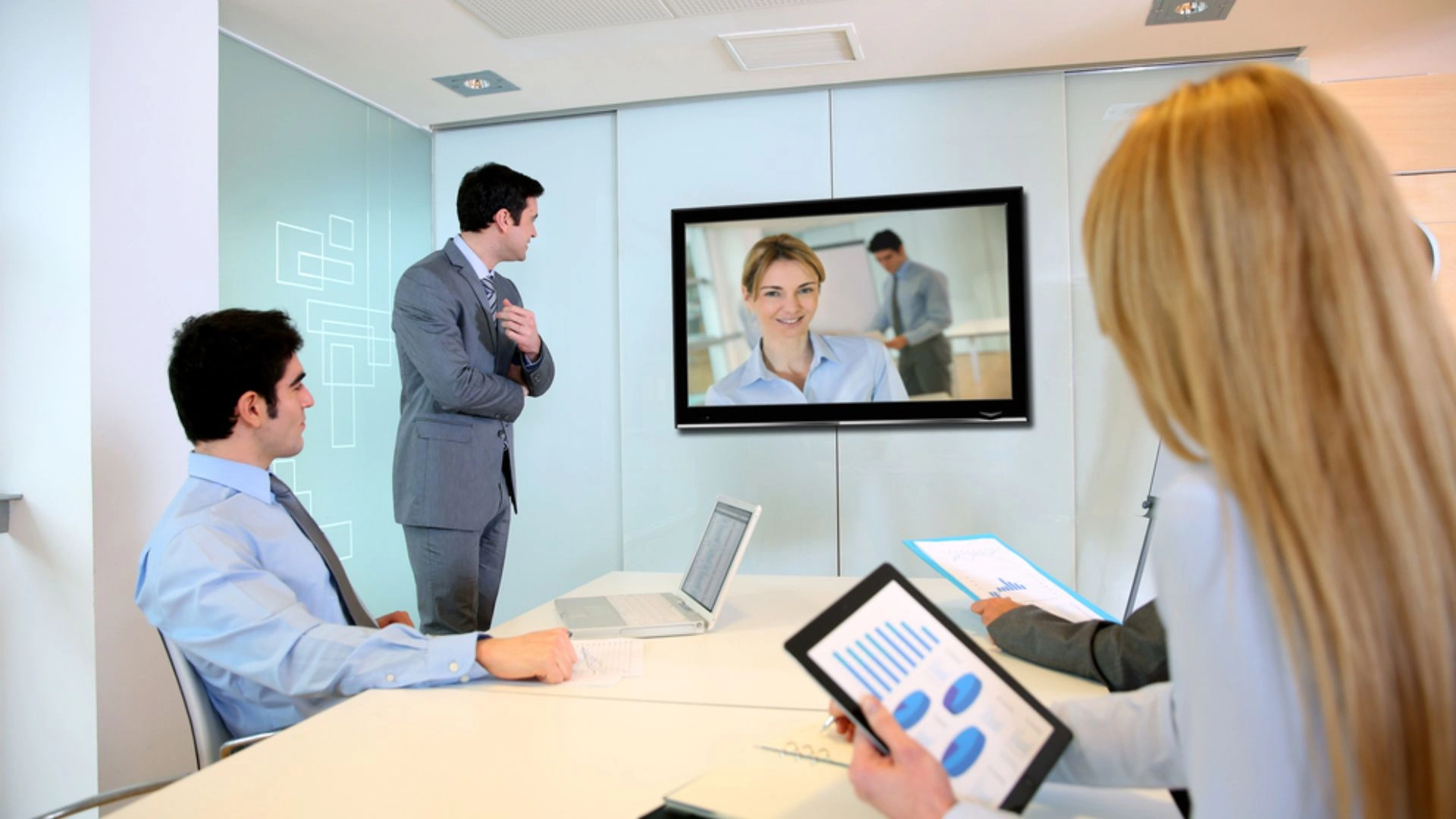 people sitting around a video conference