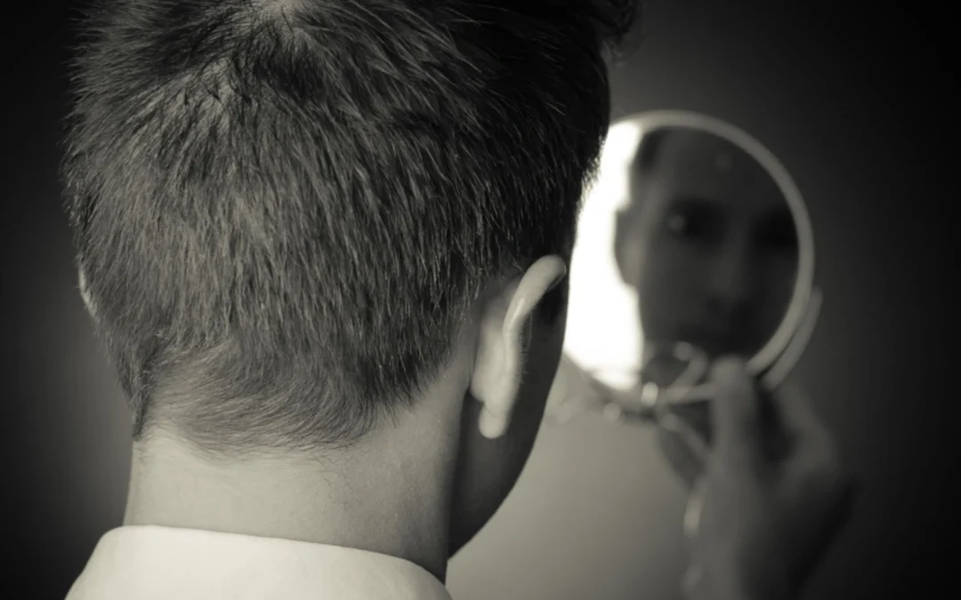 person looking into a mirror