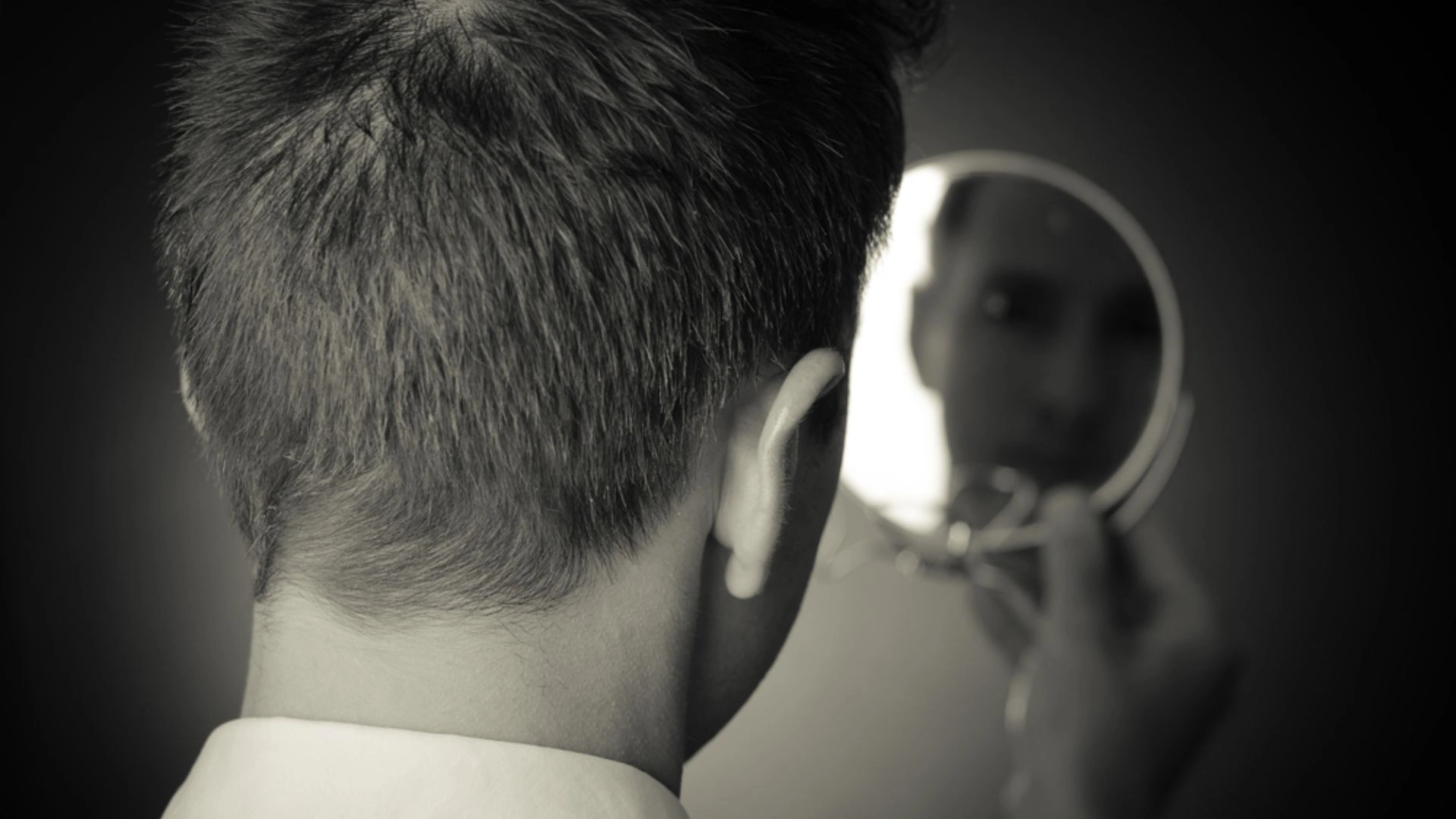 person looking into a mirror