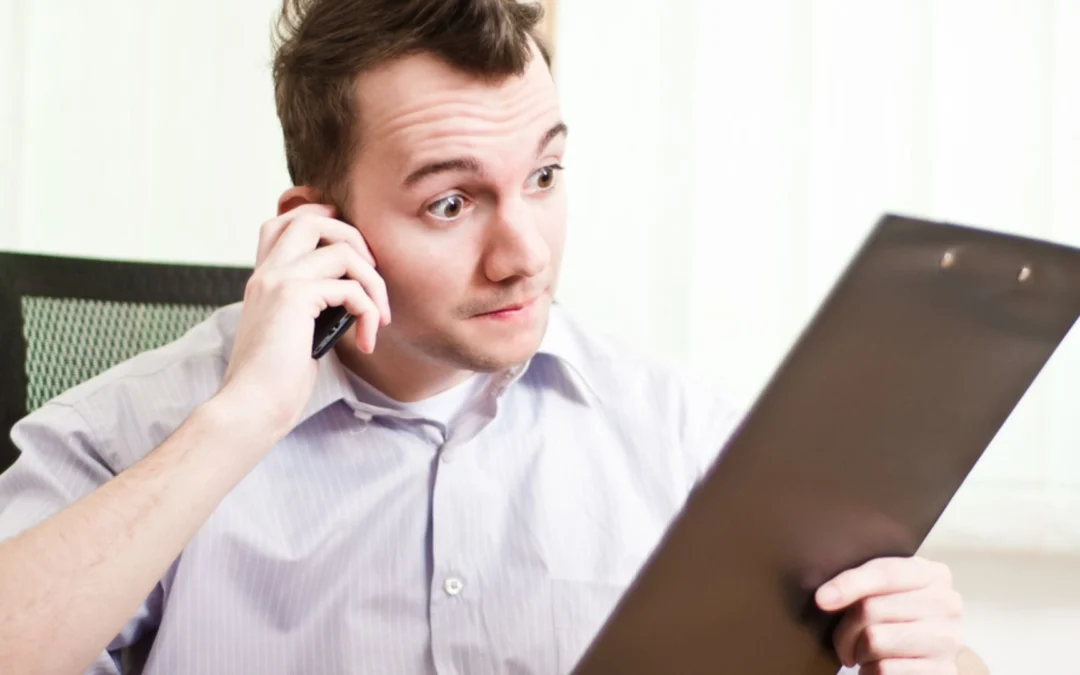 person looking dumbfounded at a clipboard