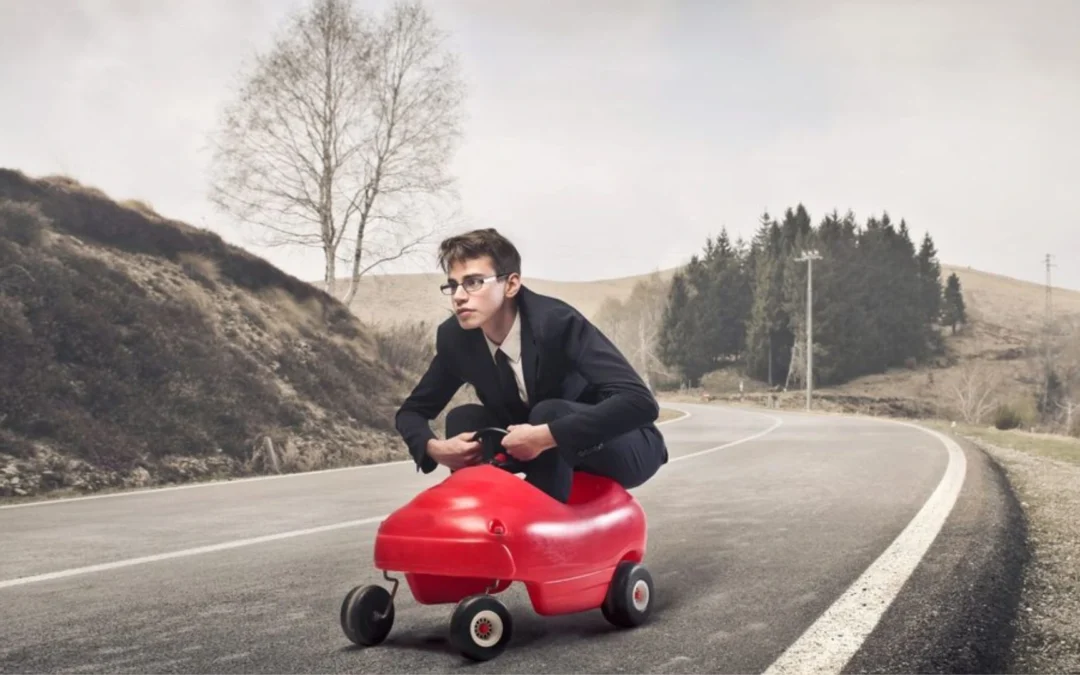 person riding in a toy car