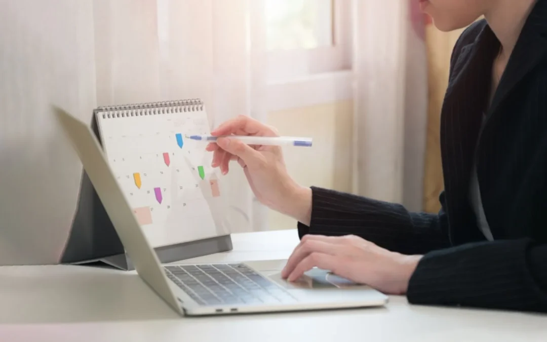 person writing 'agenda'