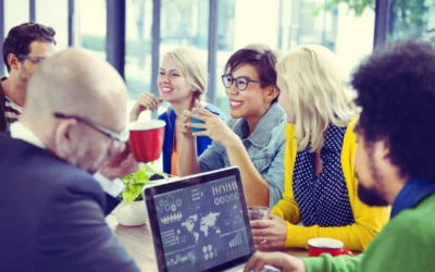 group of teammates sitting around a meeting table