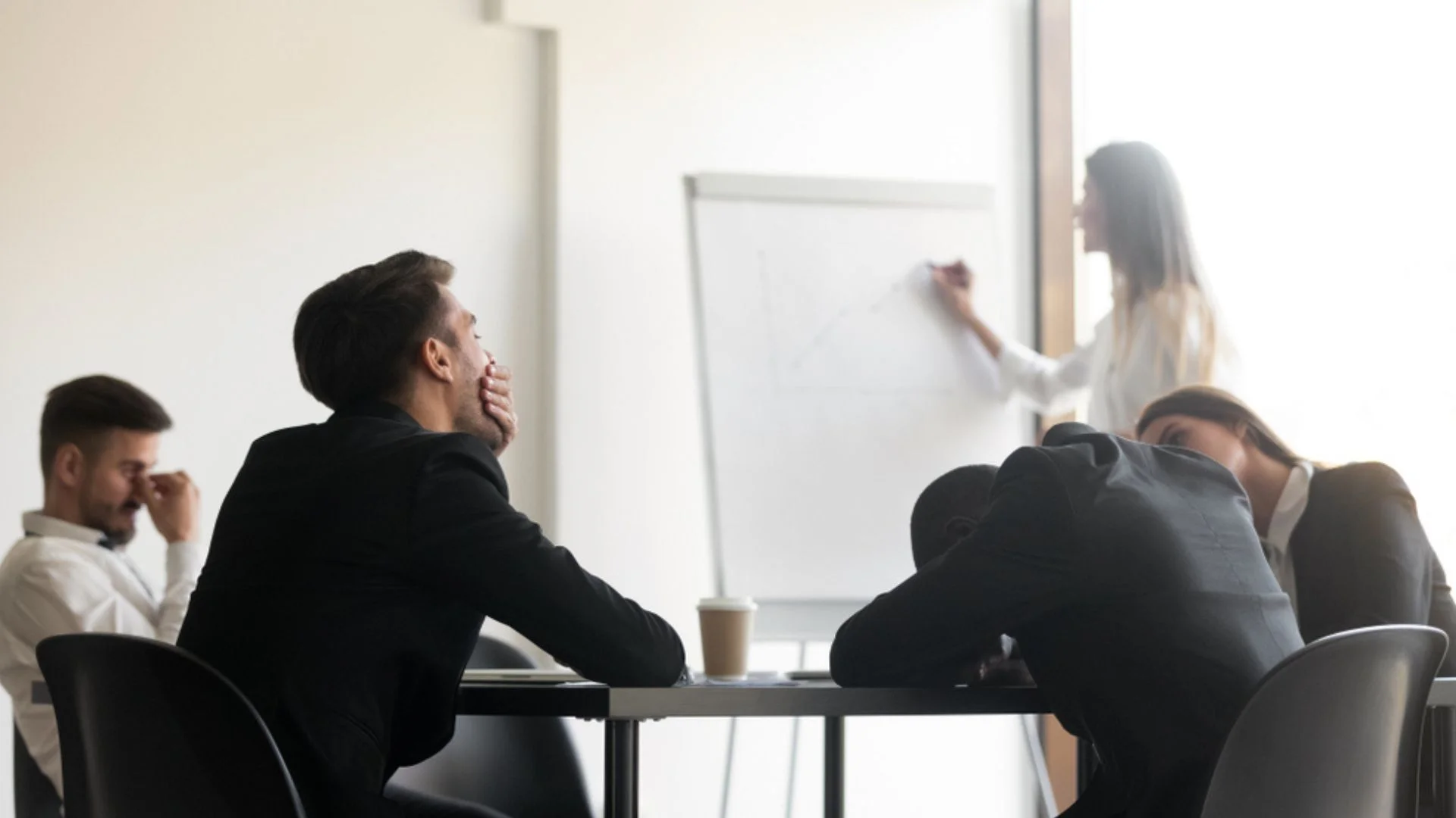 business person breathing through an oxygen tank