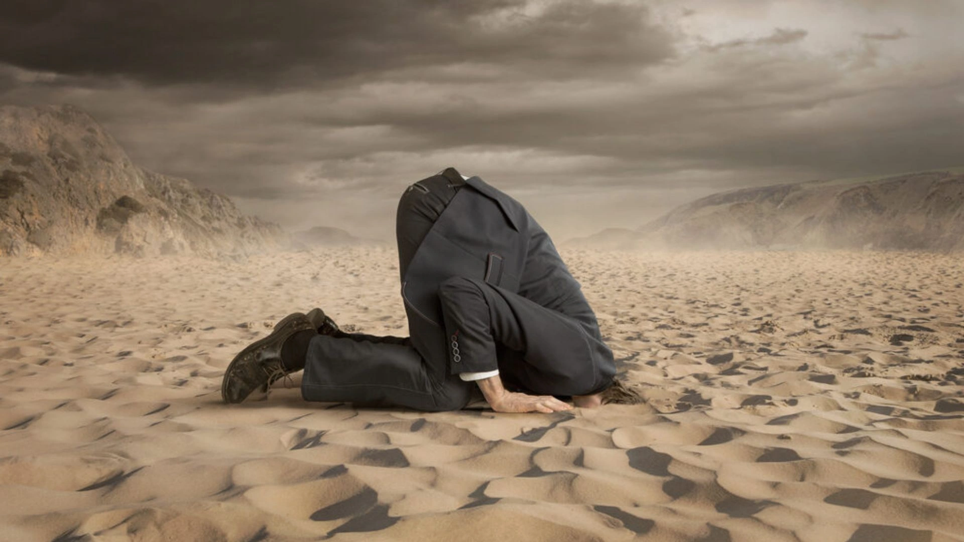 Manager with head in sand