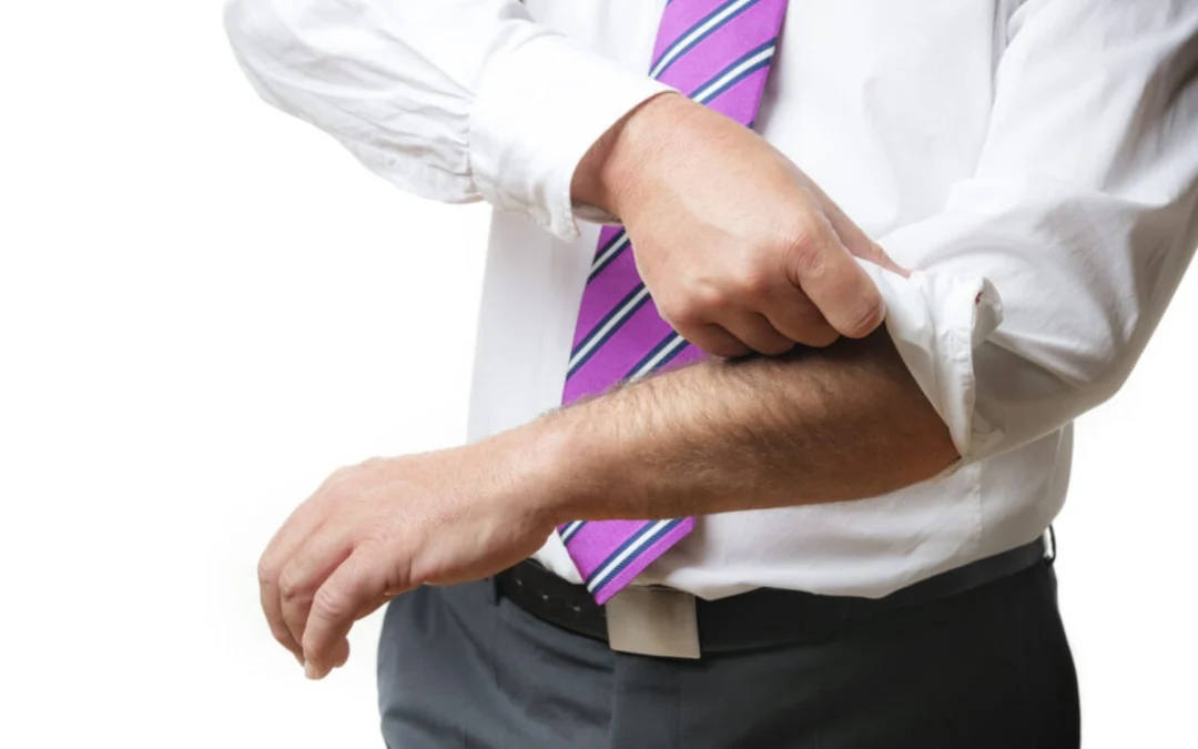 Person rolling up their sleeves