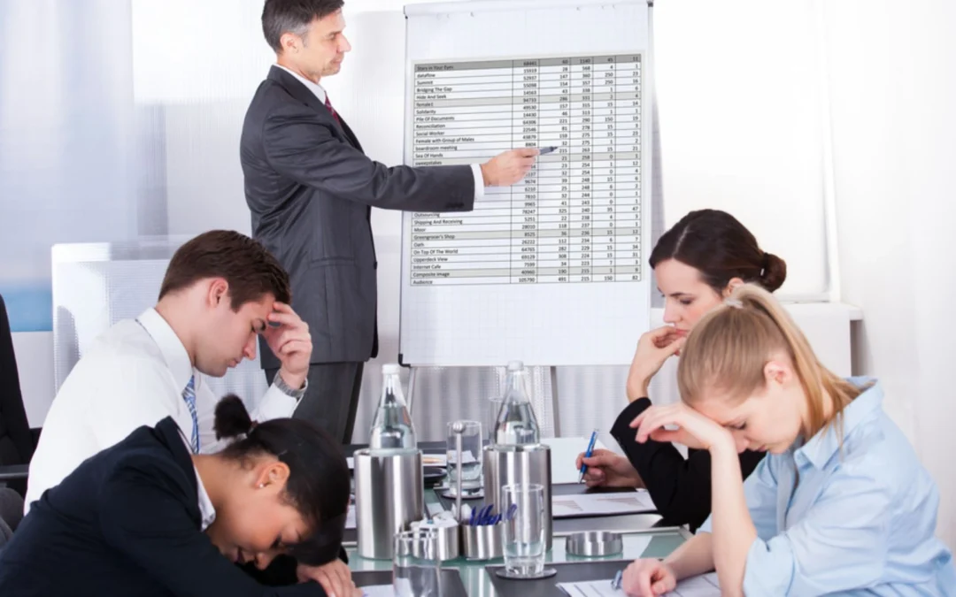 Person pointing at flip chart full of tiny data