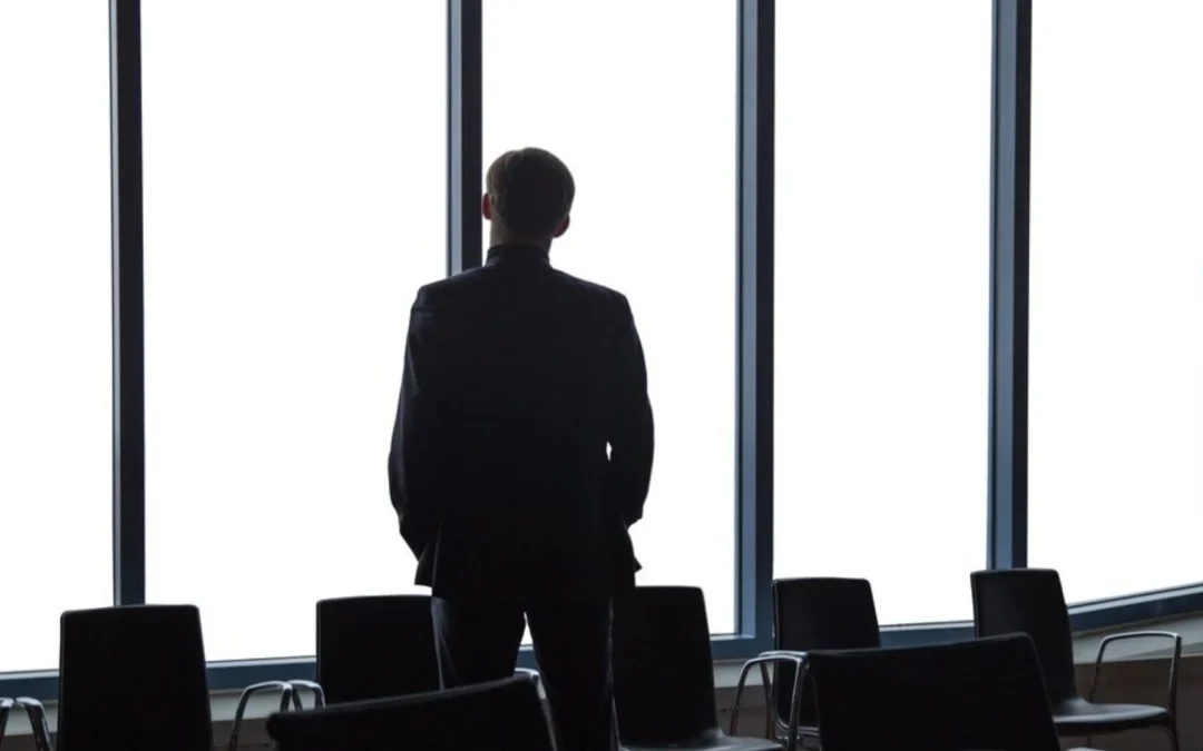 Person looking out boardroom window