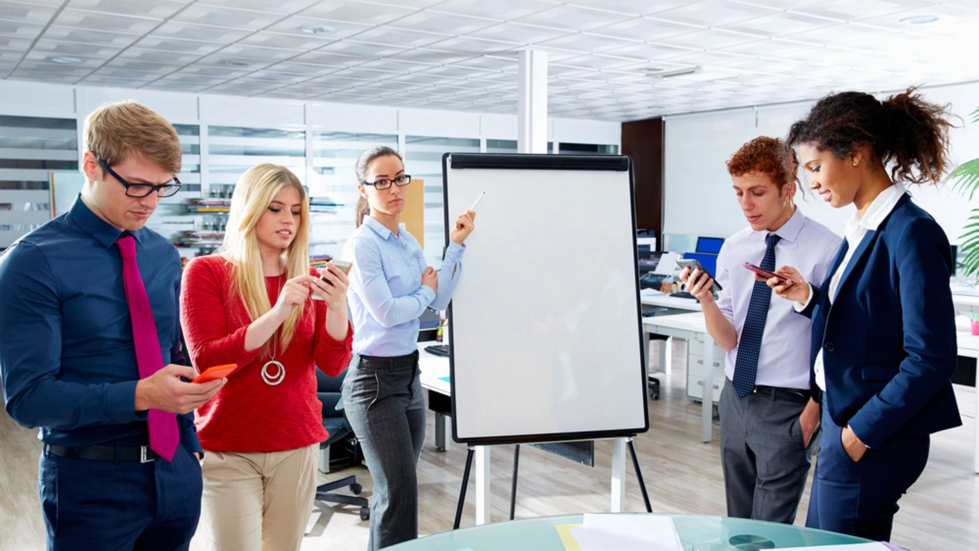 Presenter and people looking at their phones