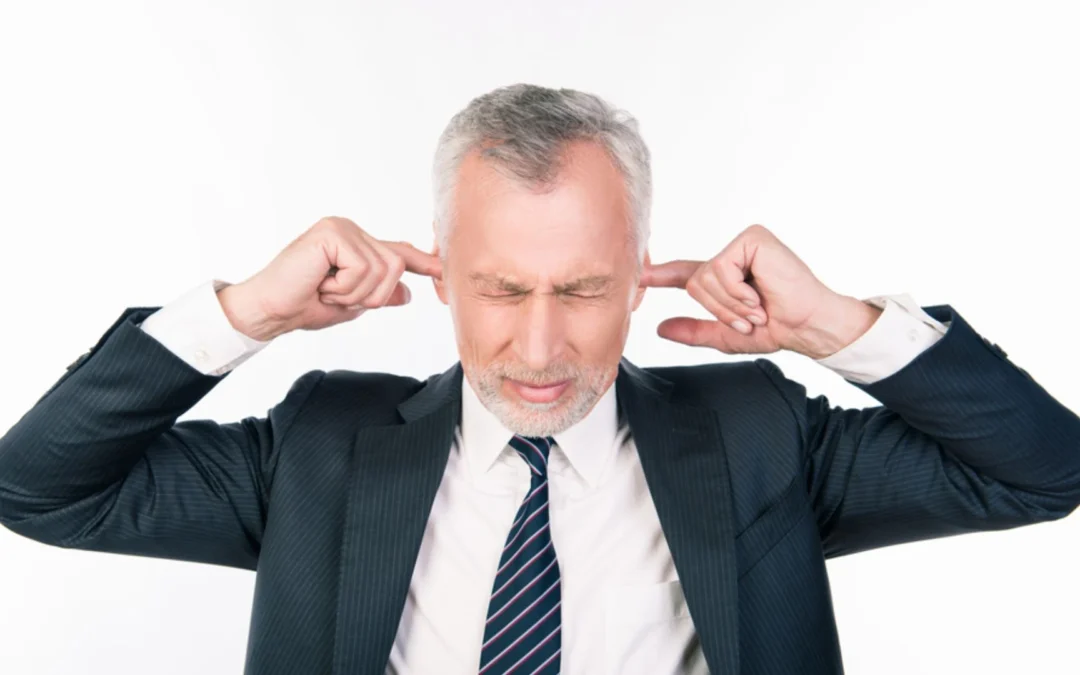 Leader with fingers in ears