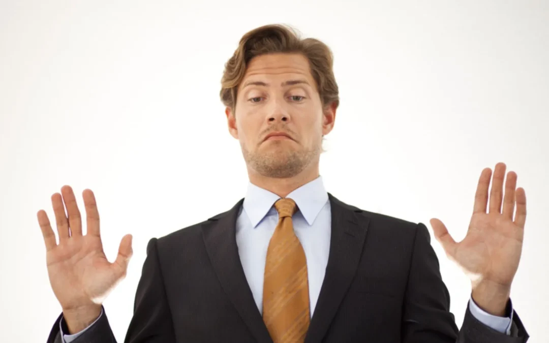 Manager holding up hands to back off