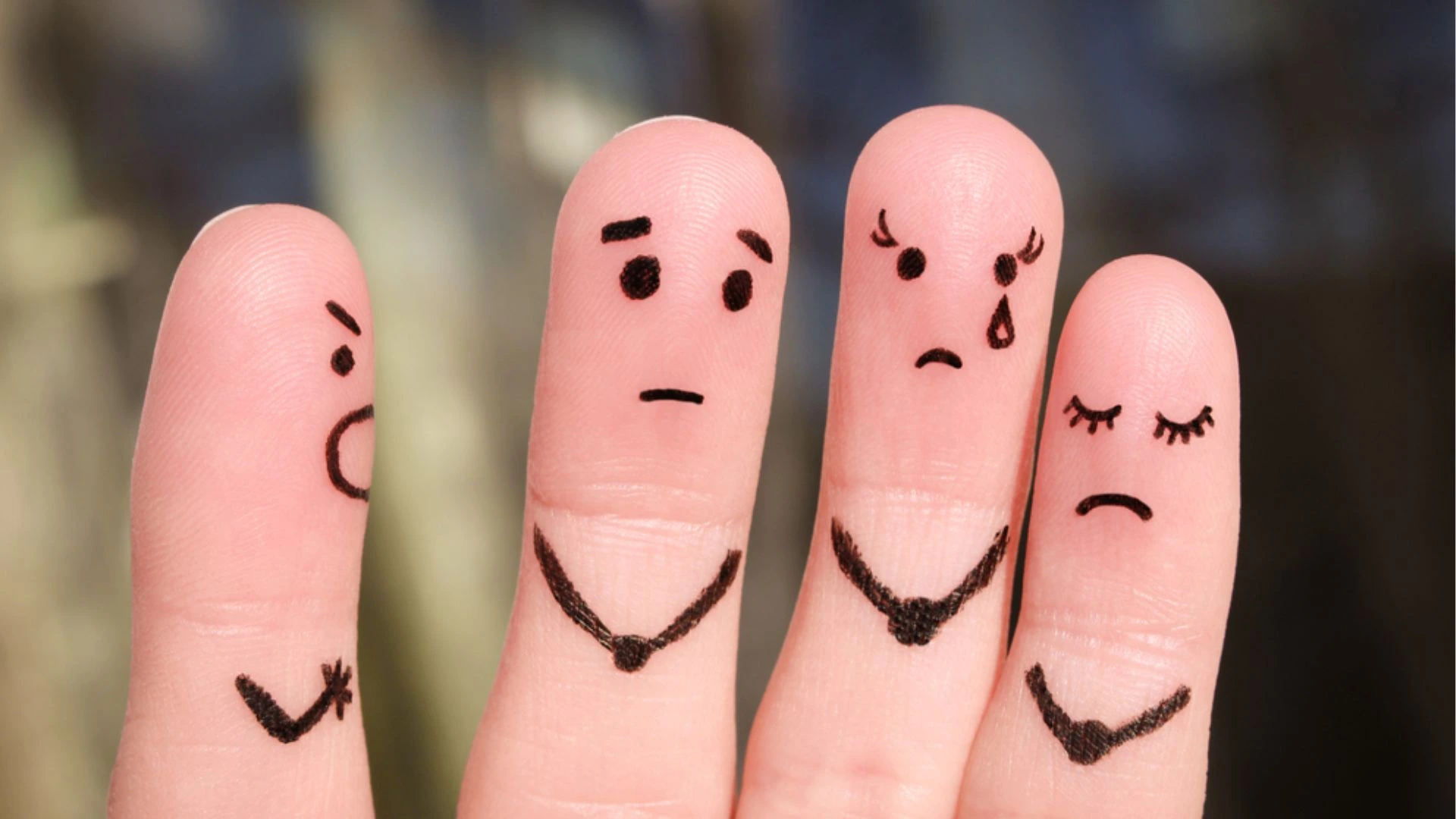 Fingers with faces showing different emotions