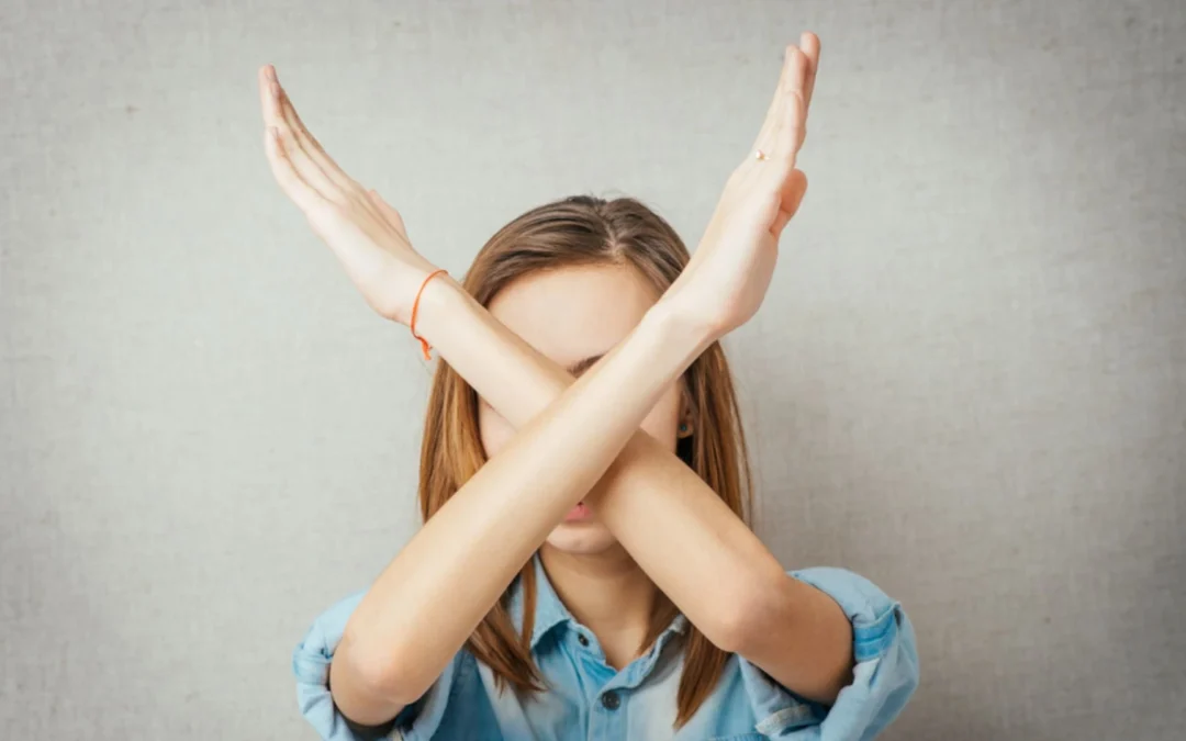 Person using arms to make an X