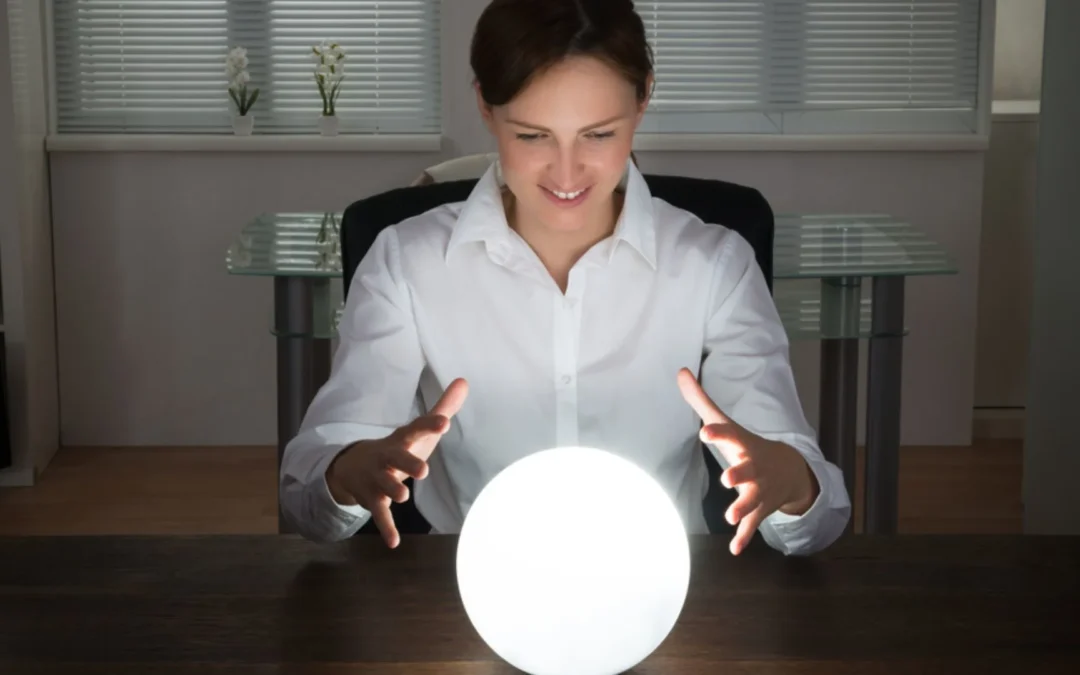 Person in an office looking into a crystal ball