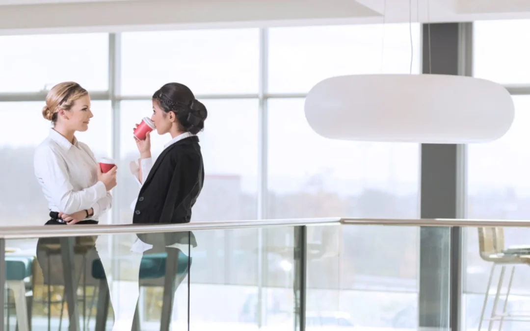 Two teammates having a hallway conversation