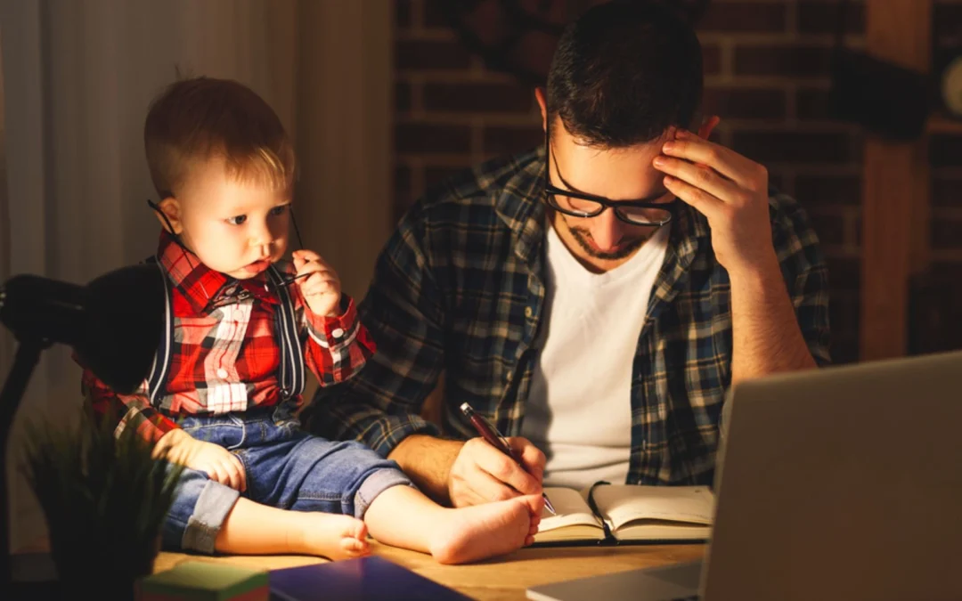 Person working from home with a kid on the desk