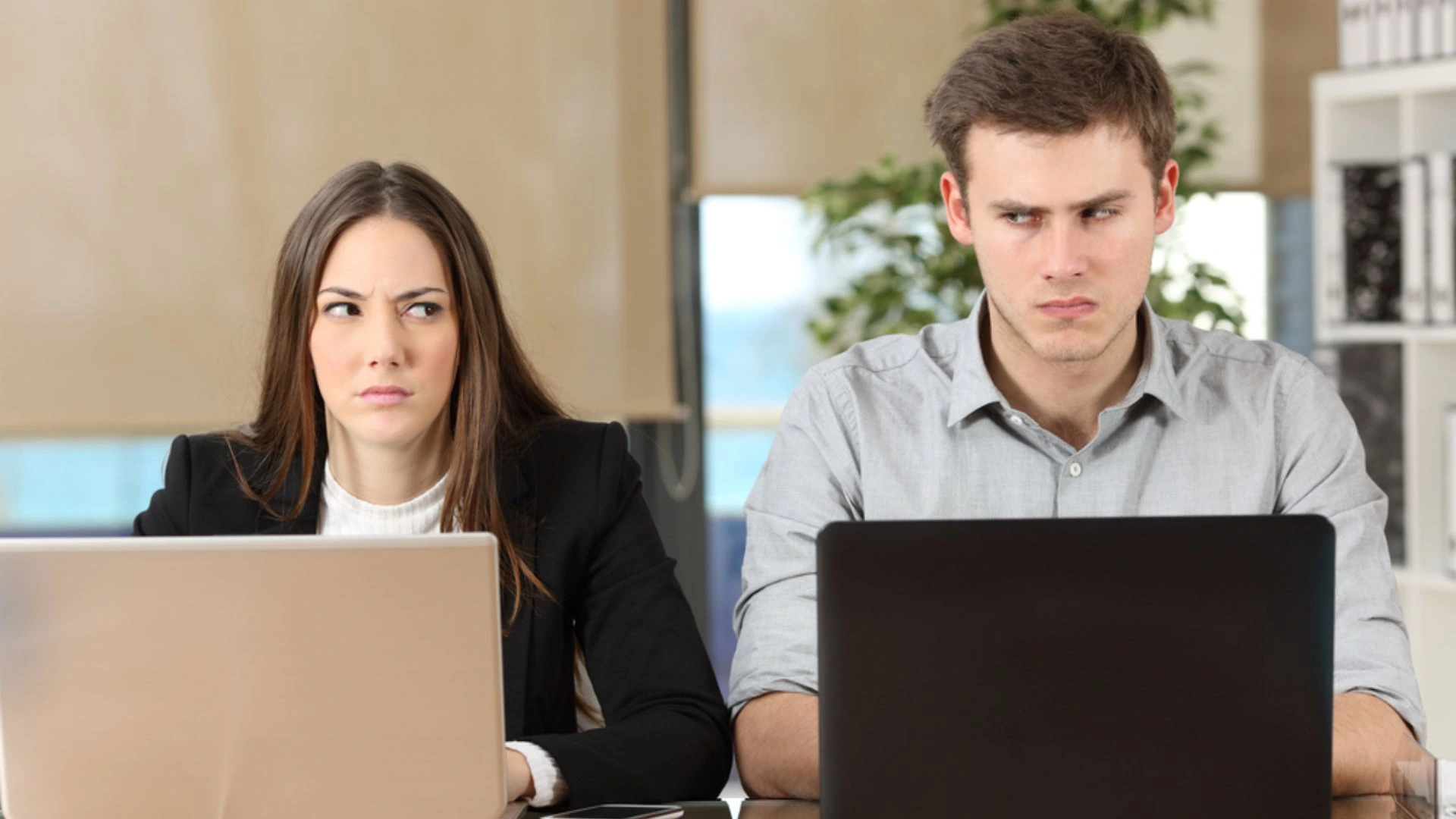 Coworkers looking at each other