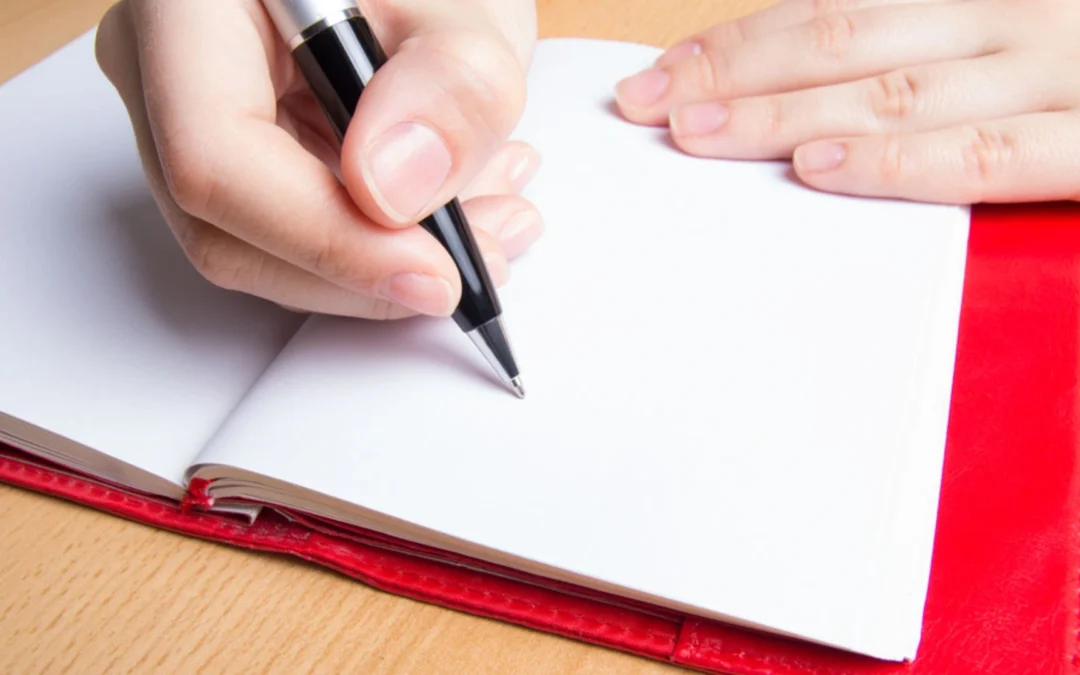 Person writing a list