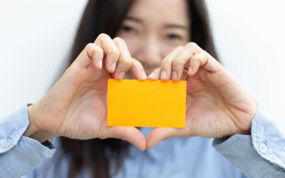 Person holding out business card