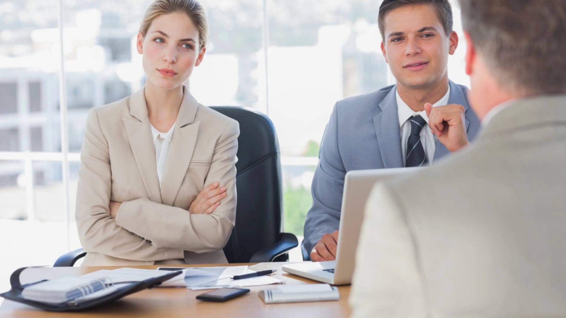 Person in a meeting looking annoyed